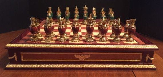 IMPERIAL FABERGE JEWELED CHESS SET: consisting of green and burgundy jeweled body chess set with 24k gold plated headpieces, inspired by the jeweled eggs of Fabergé produced by the Franklin Mint and designed by The House of Fabergé, h