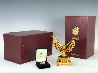 FABERGE JEWELED 24KT OVER STERLING MUSICAL EGG: By Franklin mint , with 14KT gold pin inset with precious stones, original box. Excellent condition. Estimate $4.000-5.000