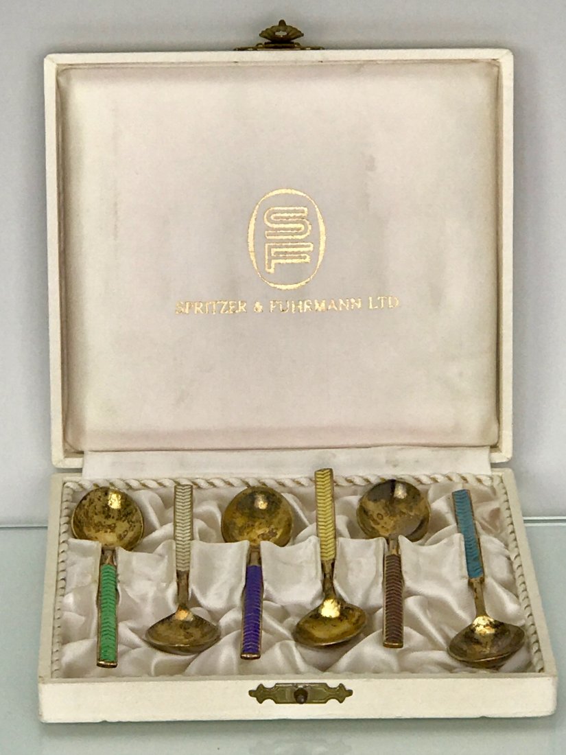 SET OF 6 SILVER AND ENAMEL TEA SPOONS: Danish silver and enamel tea spoons in original box. Estimate $250-300