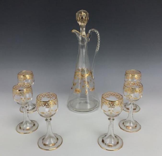 19TH C. MOSER GILT AND ENAMELED LIQUOR SET: Circa 1900. Decanter and 6 glasses. All in excellent condition. Estimate $600-800