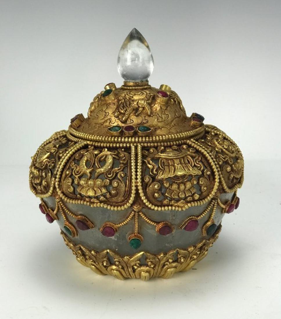 A LARGE CHINESE GILT SILVER AND ROCK CRYSTAL JAR: Inset with semiprecious stones. Measures 8.5" High. Estimate $1.200-1.500