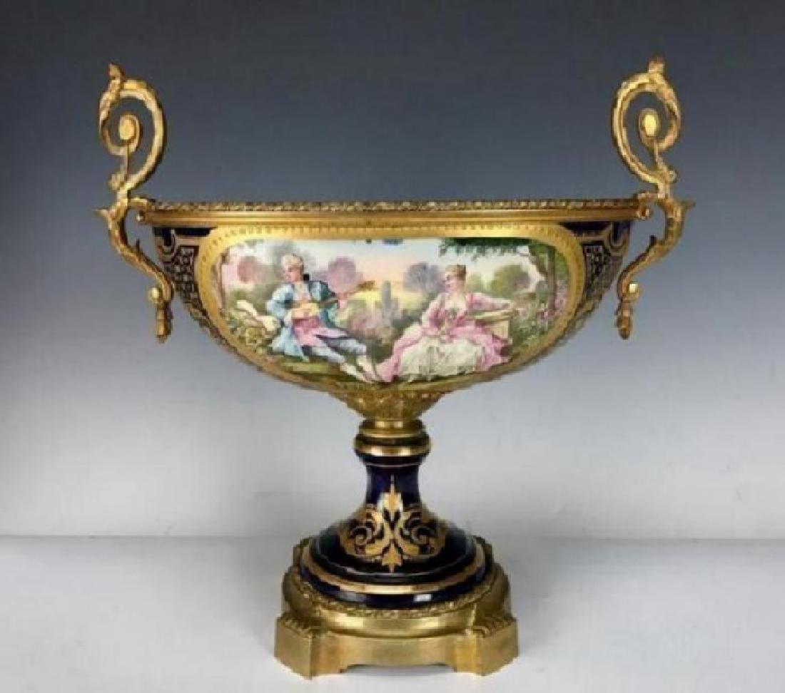 19TH C. SEVRES ORMOLU MOUNTED CENTERPIECE: Measures 12.5" L. 11.25" H. Excellent condition. Estimate $800-1.000