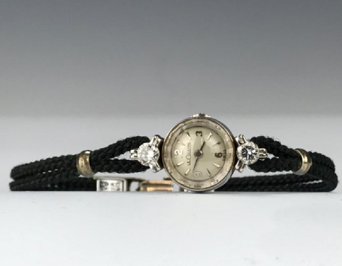 A 14KT AND DIAMOND MOUNTED JAEGER LE COULTRE WATCH (1 of 1)