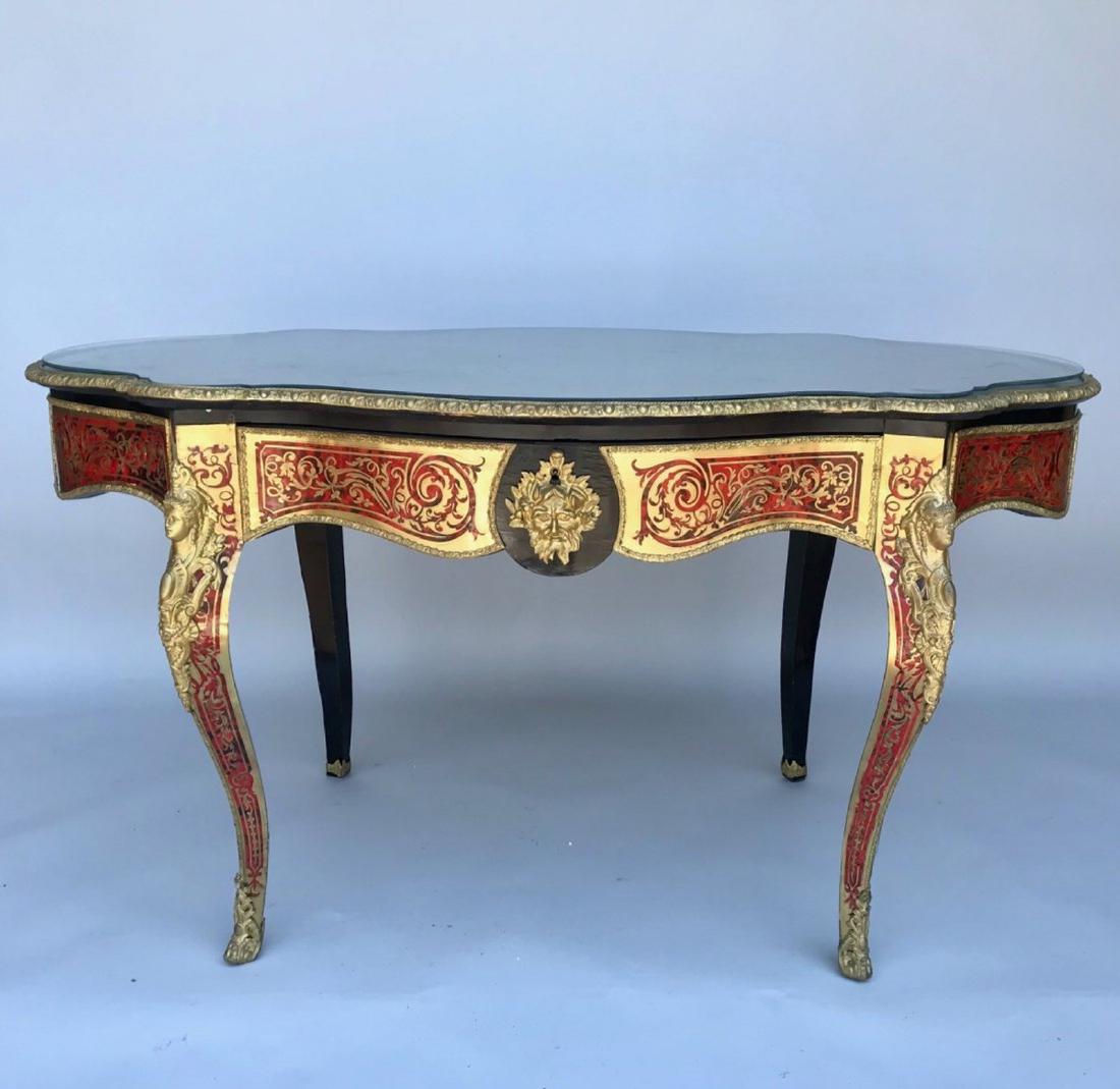 19TH C. ORMOLU MOUNTED BOULLE TABLE: Antique Louis XV-Style Bronze-Mounted Boullework Center Table, 19th c., serpentine brass and tortoiseshell inlaid top, conforming frieze, cabriole legs, h. 31 in., w. 52 in., d. 30 in . Estimate $3.00