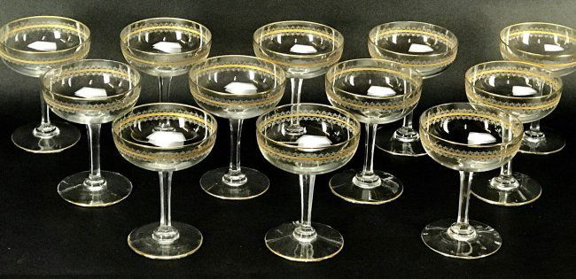 SET OF 12 GILT MOSER CHAMPAGNE GLASSES: Circa 1900. All in good condition. Estimate $300-400