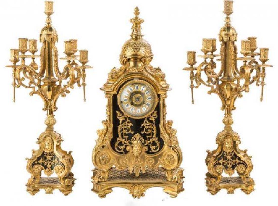 A PALATIAL DORE BRONZE CLOCK SET: A very fine ormolu clock set . Clock measures 28" High , candelabra 29" High. Good condition.Estimate $4.000-5.000