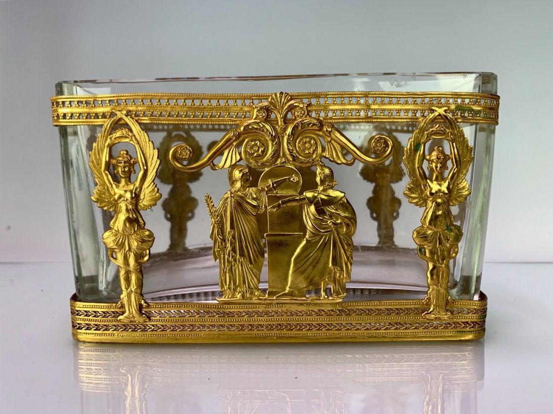 AN EMPIRE STYLE ORMOLU MOUNTED BACCARAT VIDE POCHE: Circa 1900. Measures 7.5" L., 5" H. Excellent condition. Estimate $600-800