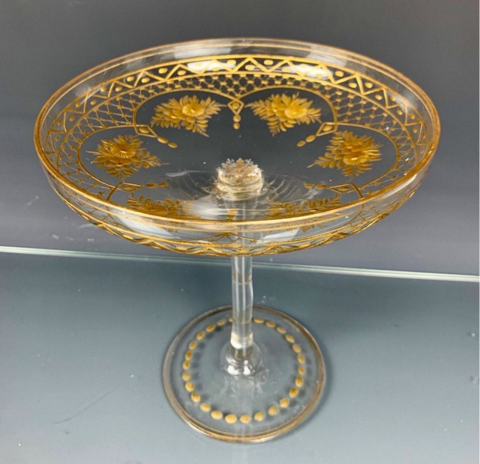 MOSER INTAGLIO CUT GILT FOOTED BOWL: Circa 1920. Measures 6.5" D. 6" H. Estimate $300-400