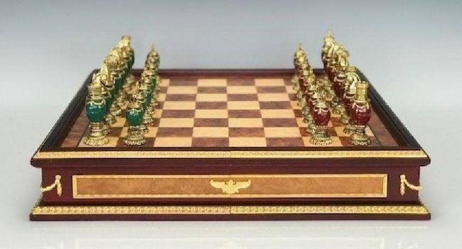 IMPERIAL FABERGE JEWELED CHESS SET: consisting of green and burgundy jeweled body chess set with 24k gold plated headpieces, inspired by the jeweled eggs of Faberge produced by the Franklin Mint and designed by The House of Faberge hous