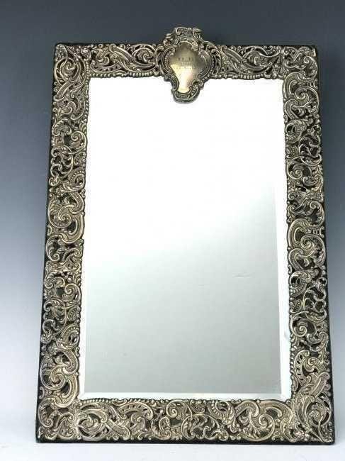 A LARGE VICTORIAN STERLING SILVER MIRROR (1 of 2)