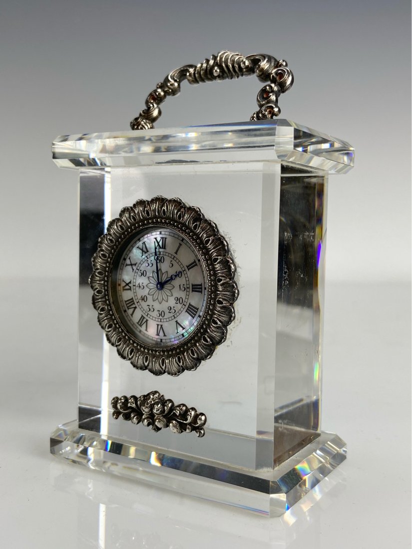 BUCCELLATI STERLING SILVER AND ROCK CRYSTAL CLOCK: Measures : h. 4-1/2", w. 2-3/4", d. 1-3/4"; . Estimate $1.200-1.500
