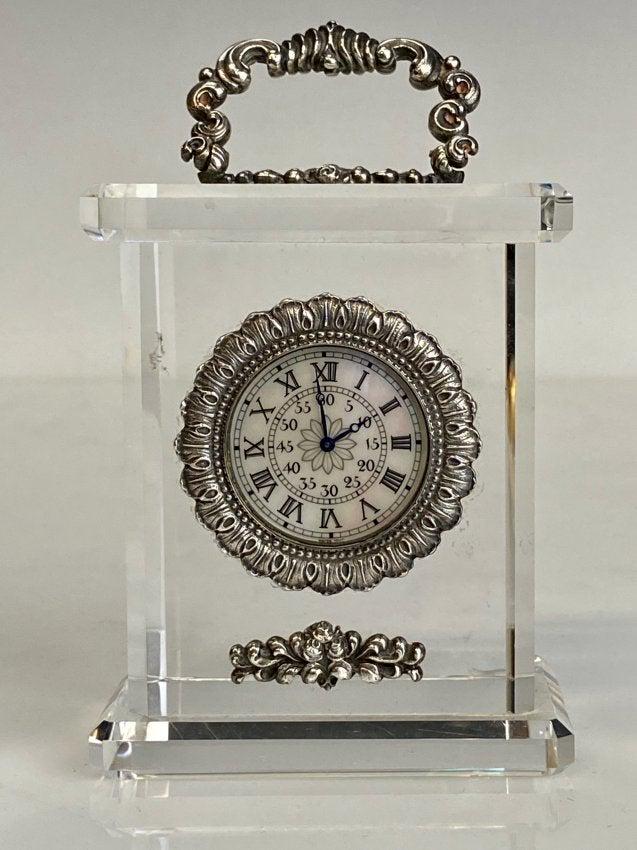 BUCCELLATI STERLING SILVER AND ROCK CRYSTAL CLOCK: Measures : h. 4-1/2", w. 2-3/4", d. 1-3/4"; . Stamped Buccelatti 925 sterling. Estimate $1.200-1.500