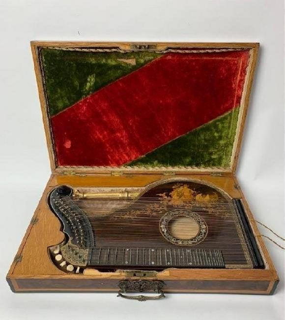 A VERY RARE MARQUETRY MUSICAL INSTRUMENT ( ZITHER): Circa 1900. In original box. Estimate $3.000-3.500