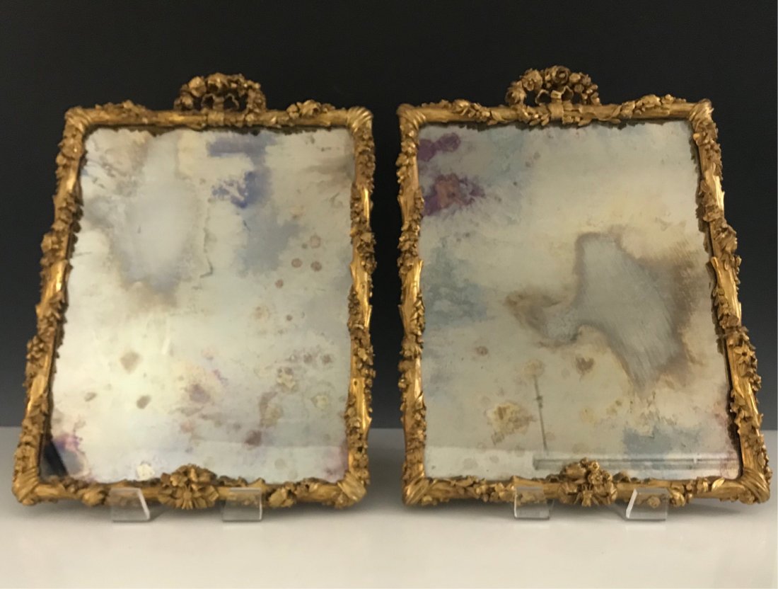 A PAIR OF19TH C CARVED GILT WOOD MIRRORS: Measure 20 x 13.5 inches. Good antique condition. Estimate $1.000-1.200