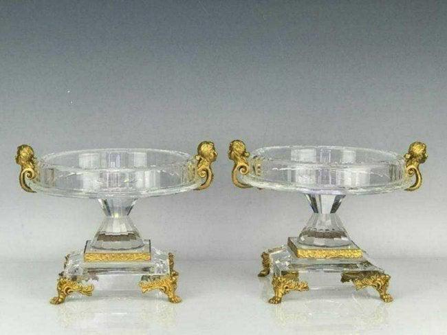 FINE PAIR OF ORMOLU MOUNTED CUT CRYSTAL COMPOTES: faceted crystal compotes with gilt bronze mounts, Measure :7 in. H., 9 1/2 in.D. Excellent condition .Estimate $1.500-2.000
