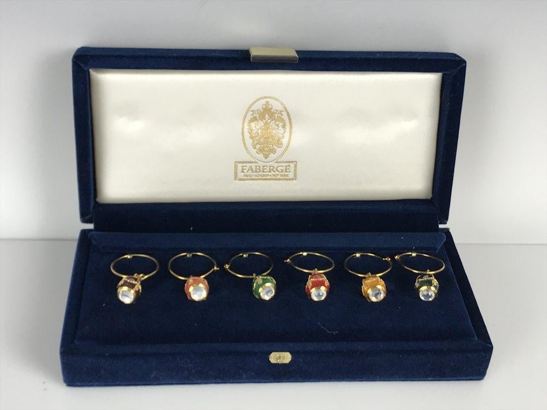 IMPERIAL FABERGE ENAMEL EGG CHARMS FOR WINE GLASSES: In original box , and certificate. Estimate $600-800