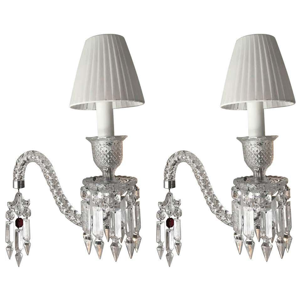 A PAIR OF FANTOME BACCARAT PENDANT LIGHTS: A pair of handcrafted full-lead crystal Fantome pendant lights designed by Arik Levy for Baccarat. Hung from silver metal ceiling mount as shown. Drop height can be adjusted. Estimate $4.000-5.000