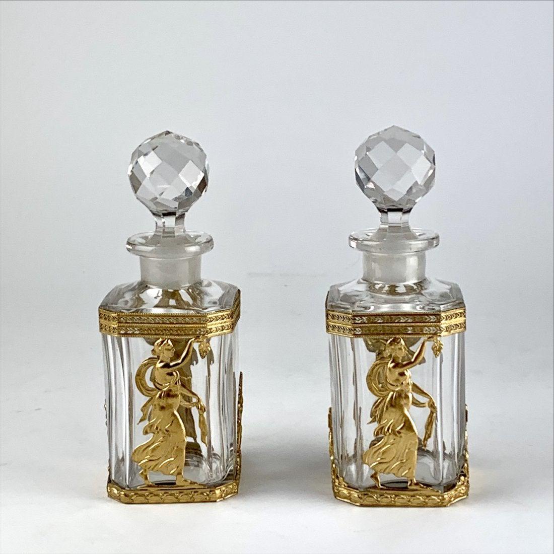 A PAIR OF ORMOLU MOUNTED BACCARAT GLASS PERFUME BOTTLES (1 of 3)
