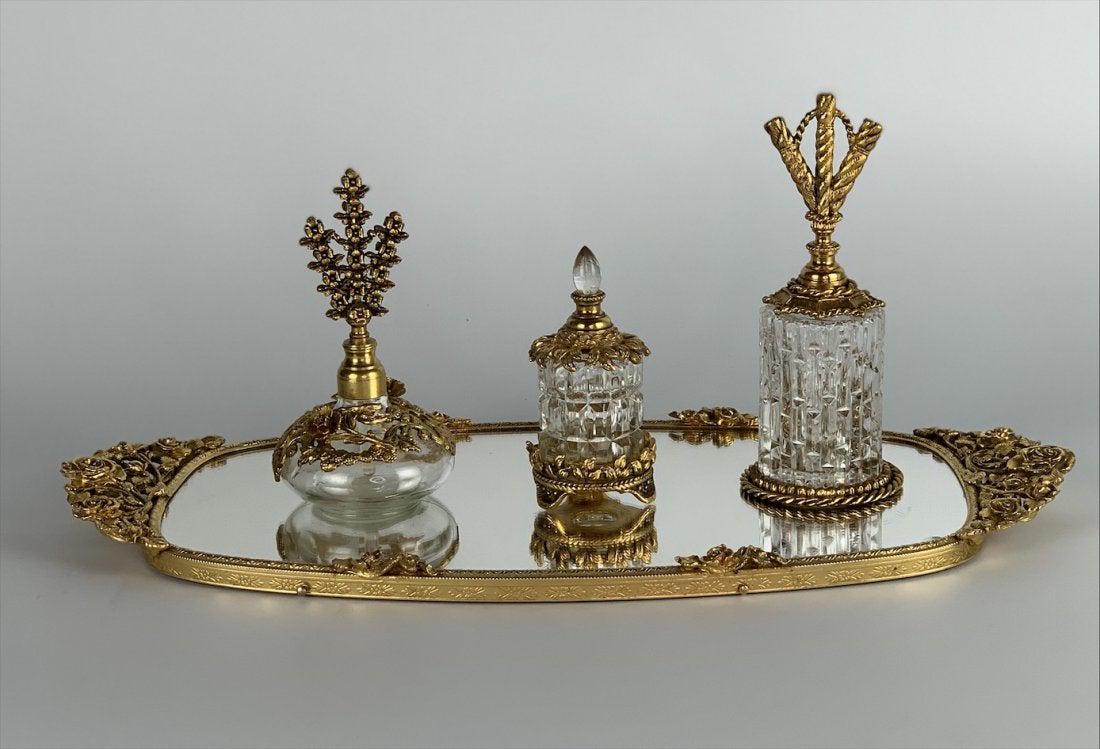 ORMOLU AND GLASS VANITY SET: Circa 1950. In good condition. Estimate $300-400