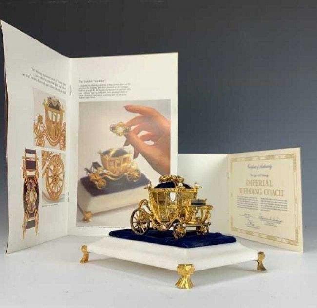 IMPERIAL CARL FABERGE WEDDING COACH 24KT GOLD OVER: Limited edition of 85/1500. Complete with 18KT gold and semiprecious stones broch,no books or brochure included. Estimate $3.000-3.500.Estimate $2.000-2.500