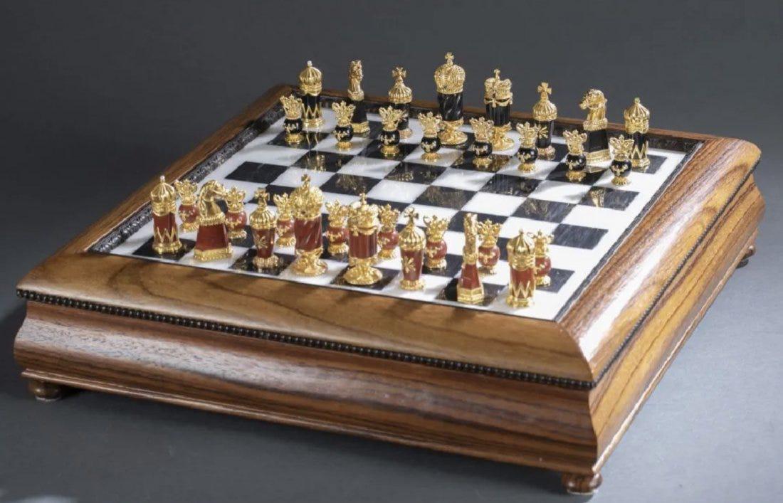 IMPERIAL FABERGE 24KT GOLD OVER SILVER CHESS SET: Faberge Imperial Jewled chess set by Igor Carl Faberge. Board constructed of polished marble set in rosewood. Playing pieces crafted in jasper, onyx and 24k gold over Sterling silver set with rubies,