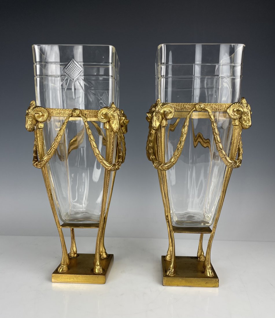 A PAIR OF ORMOLU MOUNTED BACCARAT CRYSTAL VASES: Circa 1900. Measures 12 inches high. Good antique condition.Estimate $1.000-1.200