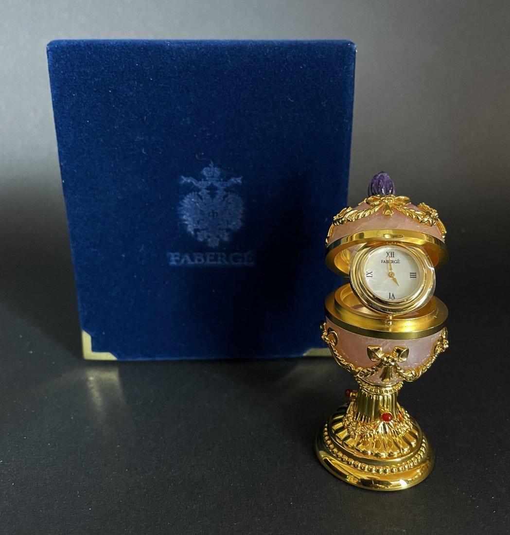 IMPERIAL FABERBE ROSE QUARTZ AND AMETHYST EGG CLOCK: In original Faberge box. In good used condition. Estimate $1.000-1.200