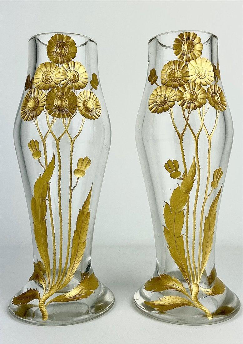 A PAIR OF INTAGLIO CUT GILT MOSER VASES: Circa 1900. Measure 9 inches tall. In good condition. Estimate $1.000-1.200