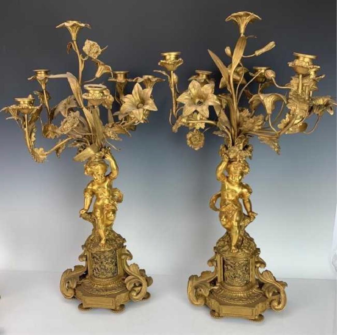 A LARGE PAIR OF DORE BRONZE FIGURAL CANDELABRA (1 of 2)