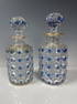 A PAIR OF BACCARAT CRYSTAL PERFUME BOTTLES