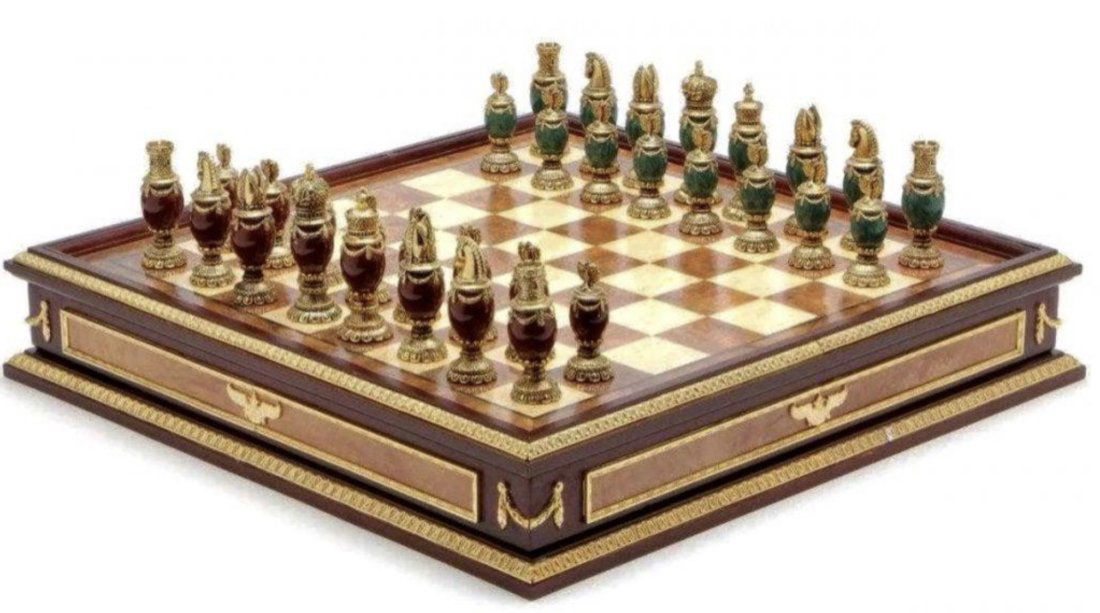 IMPERIAL FABERGE CHESS SET: consisting of green and burgundy jeweled body chess set with 24k gold plated headpieces, inspired by the jeweled eggs of Faberge, produced by the Franklin Mint and designed by The House of Faberge, ho