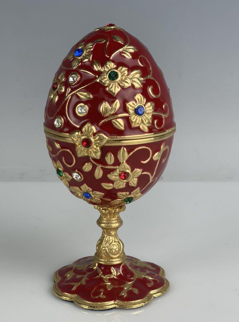 AFTER FABERGE ENAMEL EGG CLOCK: Measures 5 inches high. Good condition. Estimate $200-300