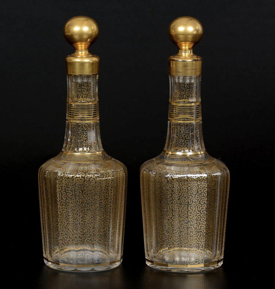 A PAIR OF GILT DECORATED BACCARAT DECANTERS (1 of 2)