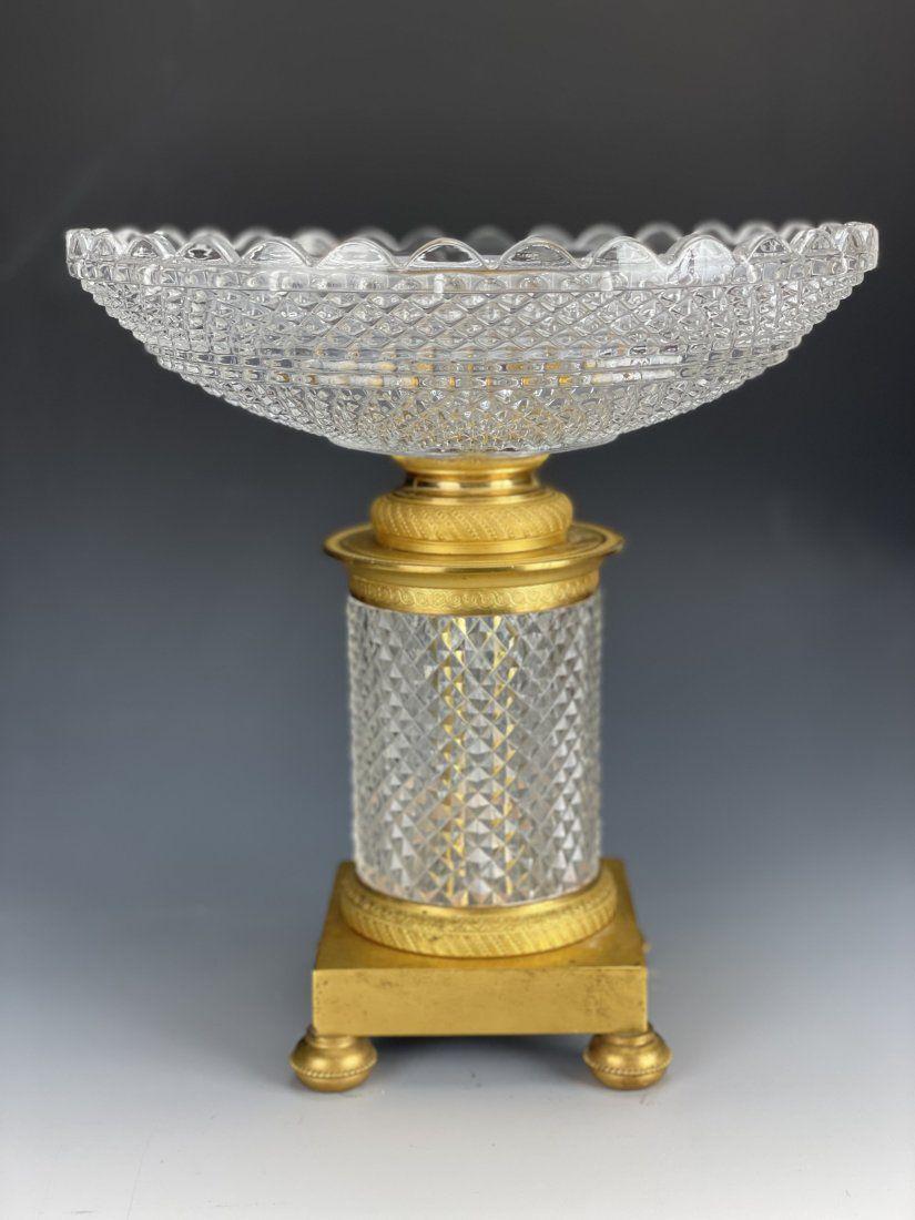 AN EMPIRE STYLE DORE BRONZE & BACCARAT CRYSTAL BOWL: Circa 1900. Measures 10 inches high, 9 inches diameter. In good condition. Estimate $1.200-1.500