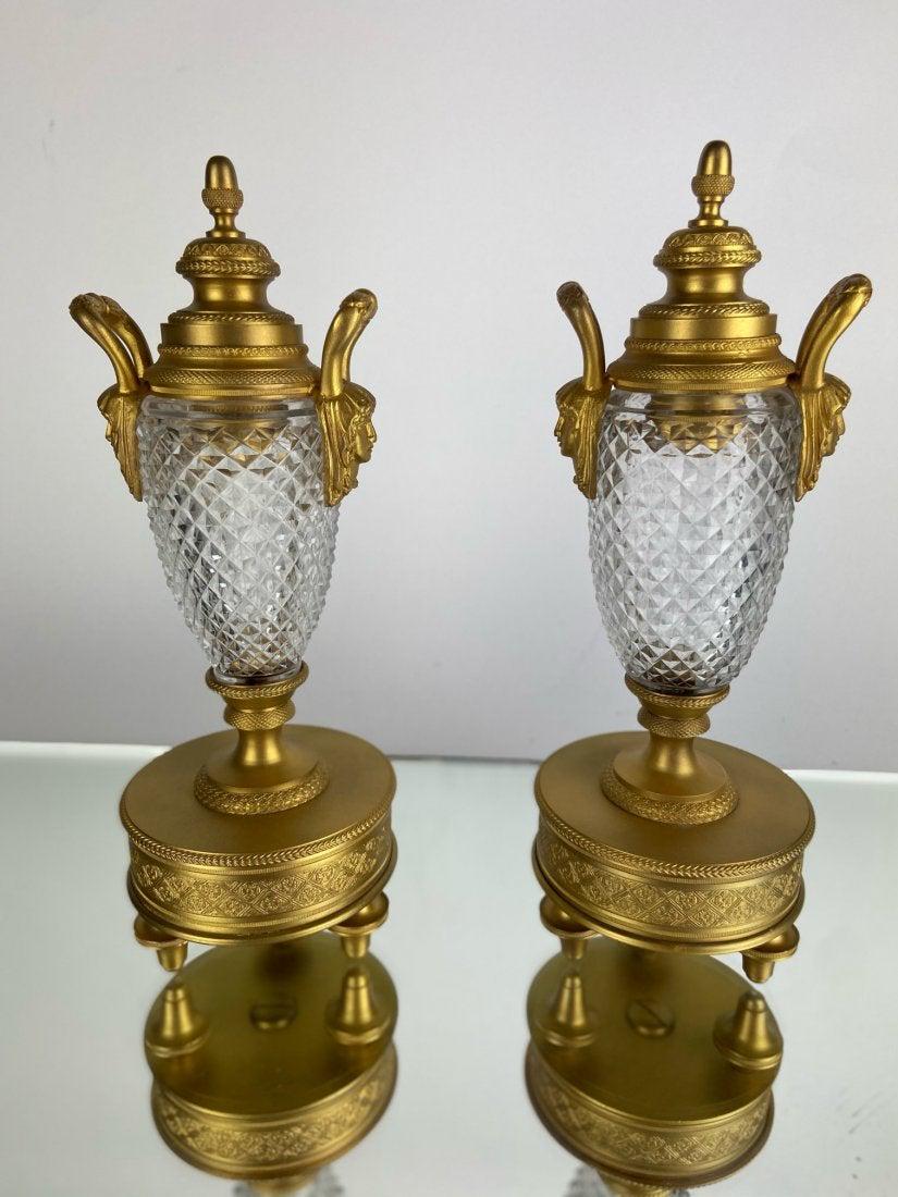 PAIR OF DORE BRONZE AND BACCARAT GLASS CADLE HOLDERS: Circa 1900. Measure 8.5 inches high. Good condition. Estimate $800-1.000