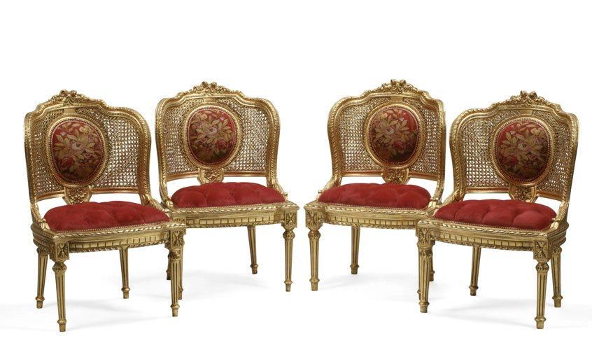SET OF 4 LOUIS XVI STYLE CANED AND GILTWOOD CHAISES: Dimensions : height 36 1/4in (92cm); width 22 3/4in (58cm); depth 23in (58 cm). Estimate $2.000-2.500