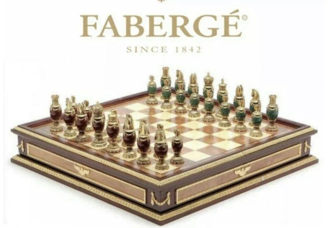 IMPERIAL FABERGE CHESS SET: consisting of green and burgundy jeweled body chess set with 24k gold plated headpieces, inspired by the jeweled eggs of Faberge, produced by the Franklin Mint and designed by The House of Faberge, ho