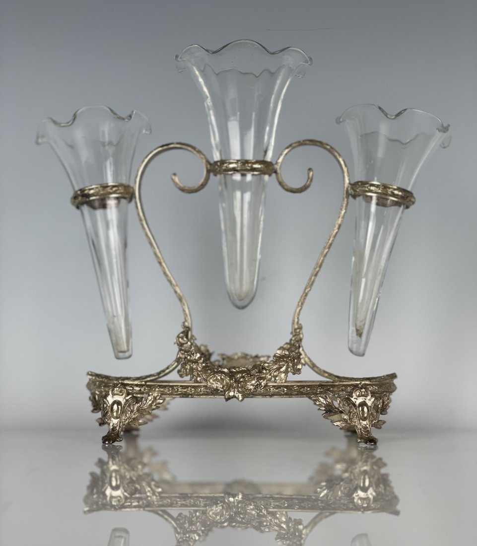FRENCH SILVER PLATED AND GLASS FLOWER HOLDER: Circa 1900. Measures 8 inches high. Retailed by Ovington New York. Good condition. Estimate $400-500