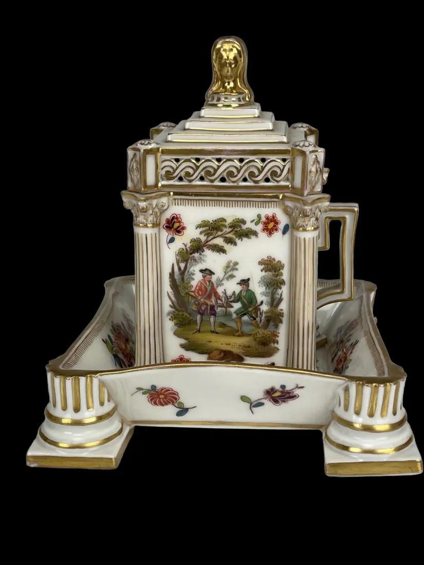 AUGUSTA REX LIDED CUP AND SAUCER: Circa 1900. In overall good condition, saucer with a minor repair, not visible. Estimate $600-800