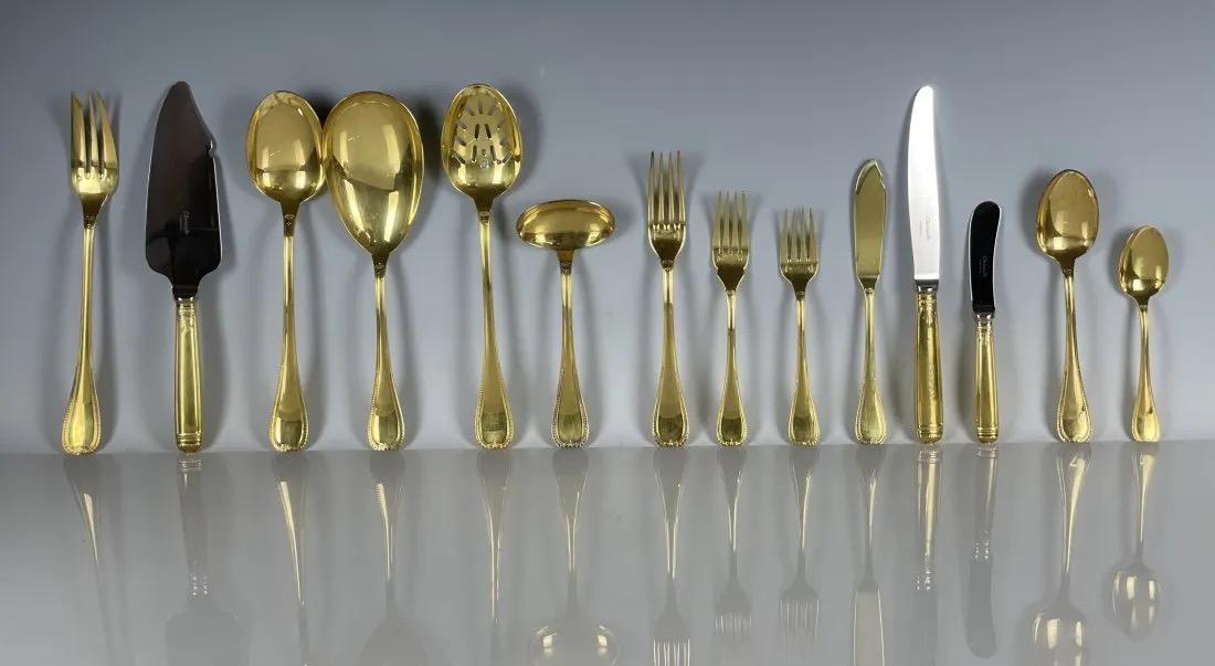 EXTENSIVE MALMAISSON CHRISTOFLE GOLD PLATED FLATWARE SET: A Christofle Gold-Plated Flatware Service, comprising of:12 salad forks12 fish knives 12 butter knives11 lunch forks13 dinner knives13 scoop spoons6 serving pieces21 teaspoons Estimate $8.000-10.000