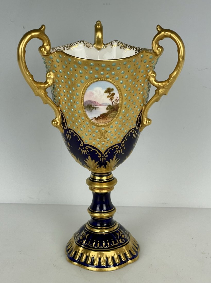 JEWELED COALPORT LOVING CUP: Circa 1900. Measures 7.5” tall. In good antique condition. Estimate $500-600
