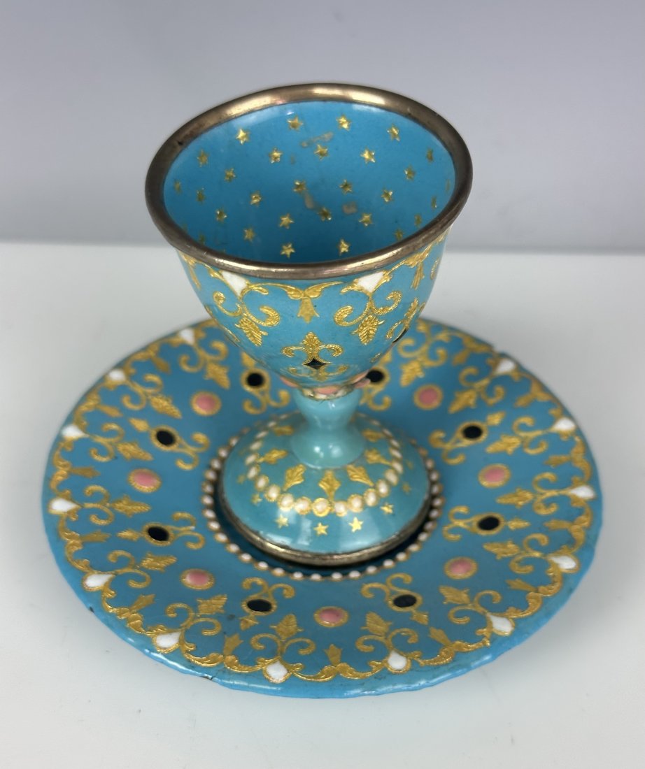 19TH C. FRENCH ENAMEL EGG HOLDER: Measures 4” high. Estimate $200-300