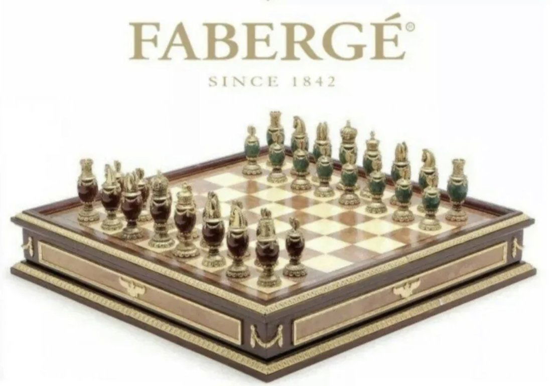 IMPERIAL FABERGE ENAMEL CHESS SET: consisting of green and burgundy jeweled body chess set with 24k gold plated headpieces, inspired by the jeweled eggs of Faberge, produced by the Franklin Mint and designed by The House of Faberge, ho
