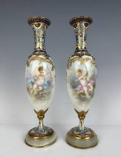 A PAIR OF FRENCH CHAMPLEVE ENAMEL AND SEVRES PORCELAIN VASES: Circa 1900. Measure 9” high. In good antique condition. Estimate $1.000-1.200