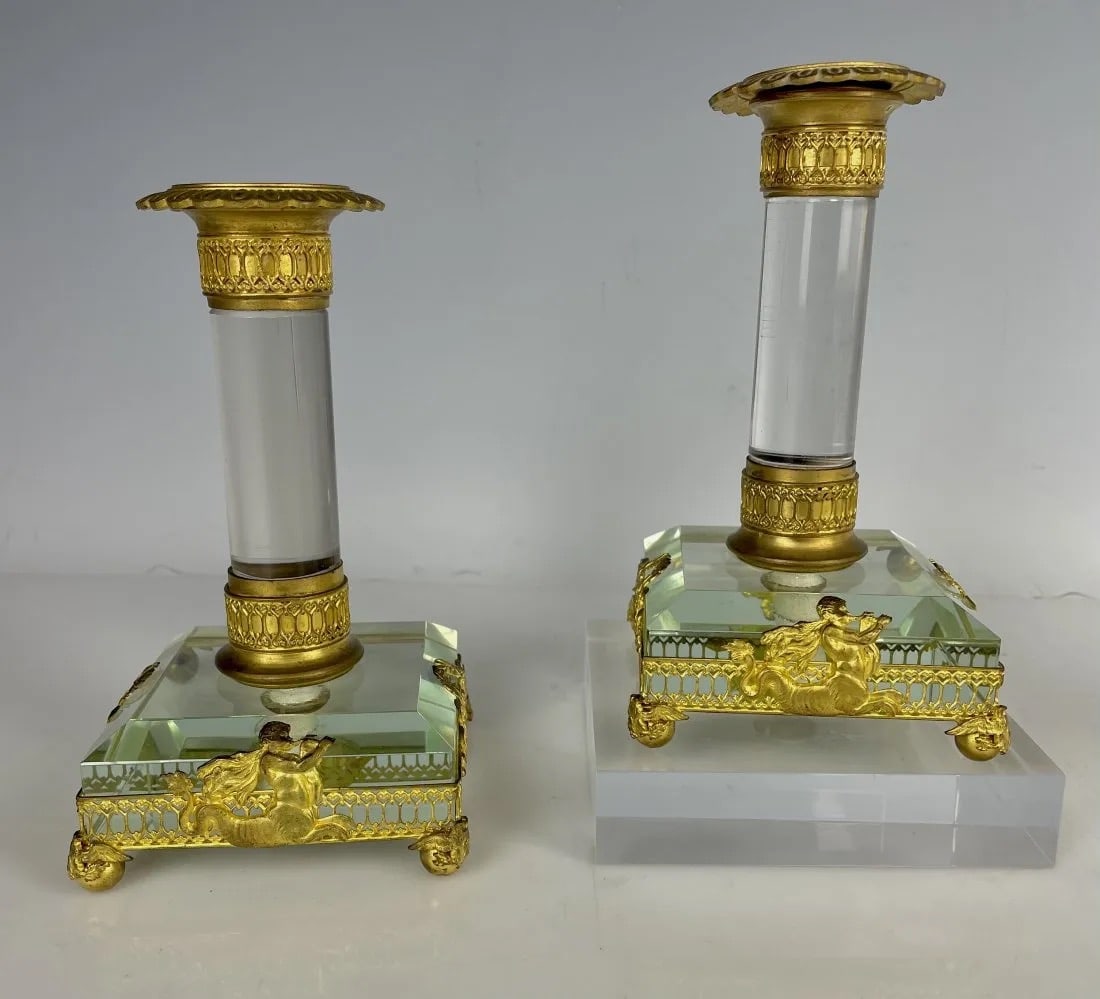 A FINE PAIR OF ORMOLU MOUNTED BACCARAT CRYSTAL CANDEL STICKS: Circa 1900. Measure 6.5 inches tall. In good antique condition. Estimate $600-800