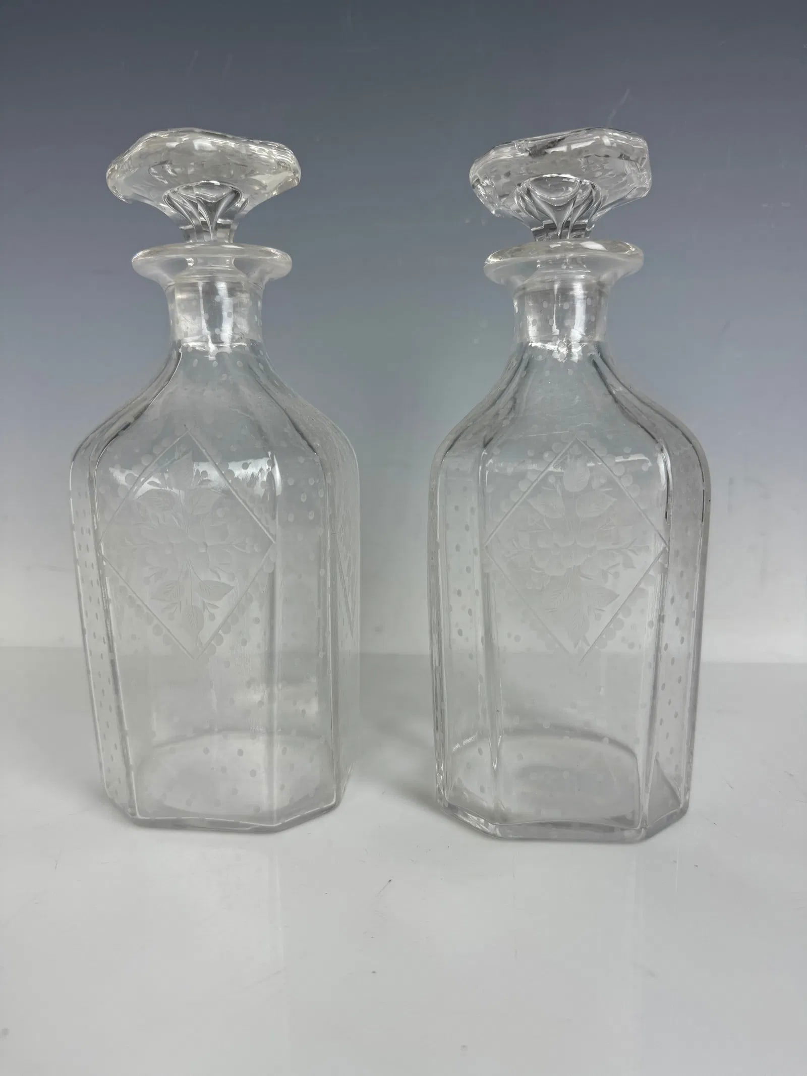 A PAIR OF ETCHED BACCARAT CRYSTAL BOTTLES (1 of 2)