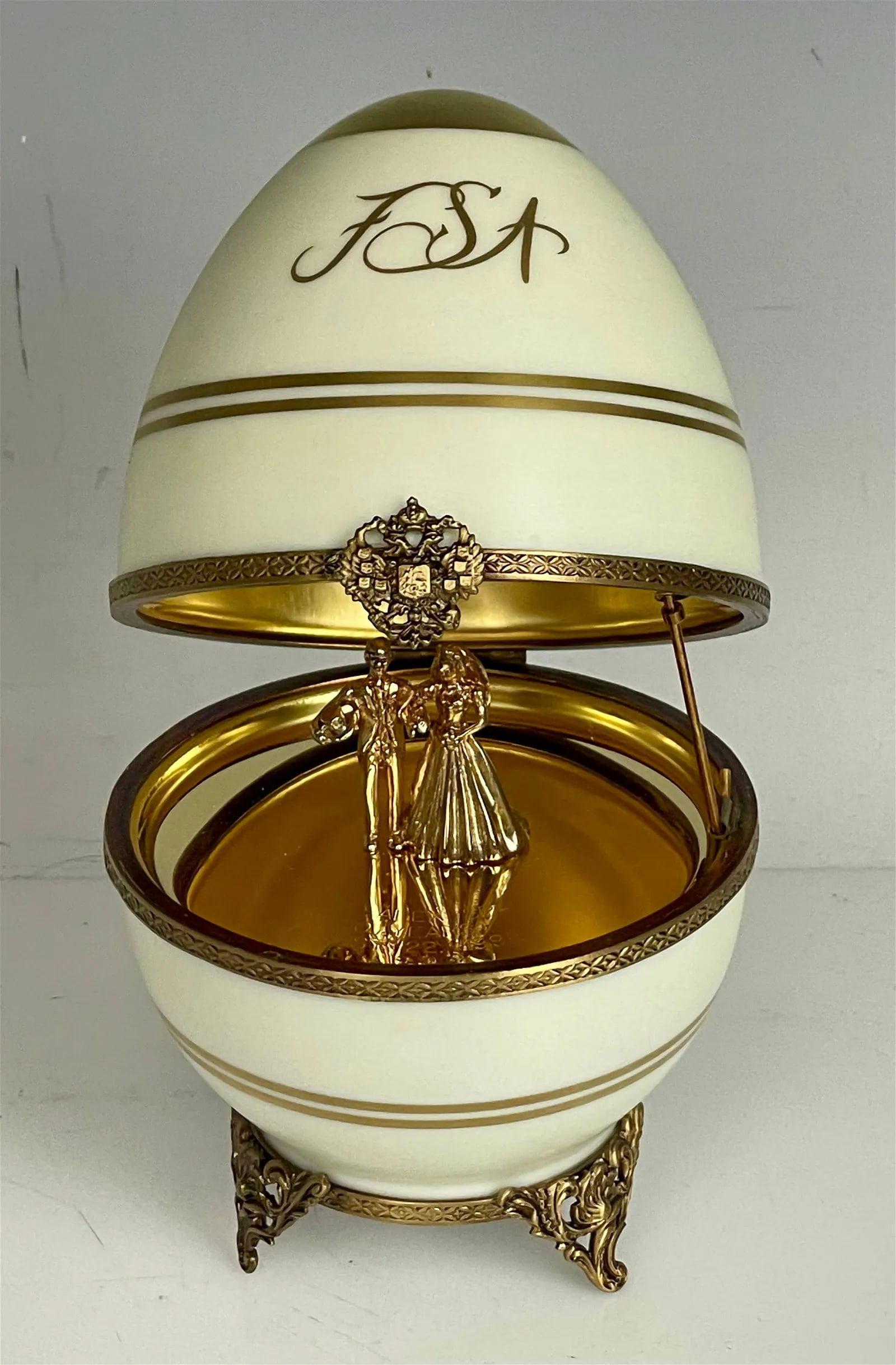 A LARGE IMPERIAL FABERGE LIMOGES PORCELAIN AND STERLING SILVER EGG: Circa 1980. Measures 8 inches high. Marked 925 Sterling , and Limoges porcelain. In good condition.Estimate $800-1.000