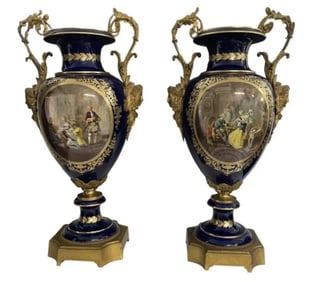 A PALATIAL PAIR OF ORMOLU MOUNTED SEVRES PORCELAIN VASES