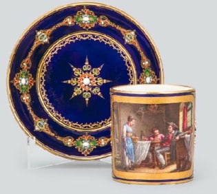 A VERY FINE JEWELLED SEVRES CUP AND SAUCER