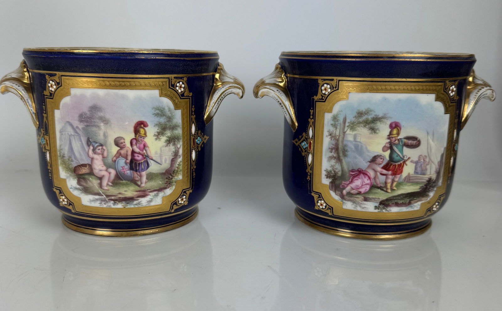 A PAIR OF JEWELED SEVRES FLOWER POTS
